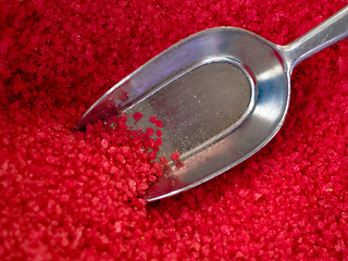 Image showing scoop in red candy