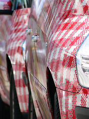 Image showing Row of red and  white cars