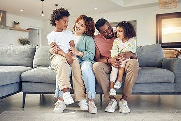 Image showing Black family, love and bond on a sofa, happy and smile while talking and enjoying a morning in their home. Relax, children and parents on couch together, embrace and loving in living room on weekend