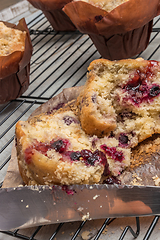 Image showing Muffins with red fruits jam fill.
