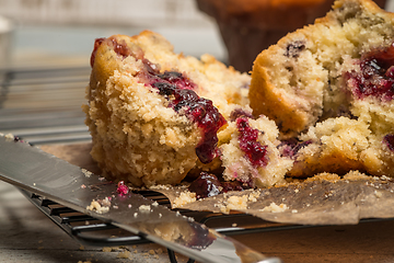 Image showing Muffins with red fruits jam fill.