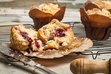 Image showing Muffins with red fruits jam fill.