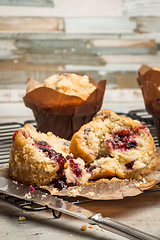 Image showing Muffins with red fruits jam fill.