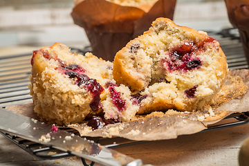 Image showing Muffins with red fruits jam fill.