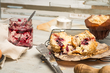 Image showing Muffins with red fruits jam fill.