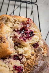 Image showing Muffins with red fruits jam fill.