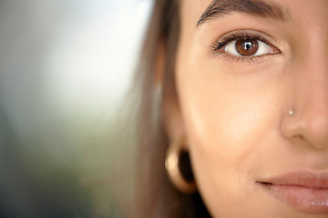 Image showing Business woman, portrait and face closeup with mock up and eye vision with blurred background. Young female, gen z person and entrepreneur with beauty and facial piercing feeling relax with mockup