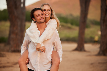 Image showing Love, piggy back and couple in forest, quality time and celebrate anniversary, relationship and happiness. Romance, happy man carry woman and smile outdoor, calm and loving with joy, bonding or break