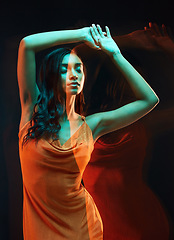 Image showing Double exposure, abstract fashion and woman in a dress isolated on a black background in studio. Freedom, art and an artistic girl posing for creativity, style and elegance on a dark backdrop