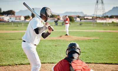 Image showing Baseball, bat and ready with a sports man outdoor, playing a competitive game during summer. Fitness, health and exercise with a male athlete or player training on a field for sport or recreation