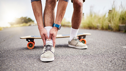 Image showing Ankle pain, injury and skater with ache or hurt foot while skating on the road or street as extreme sport. Exercise, fitness and skateboarder with muscle strain in an emergency due to accident