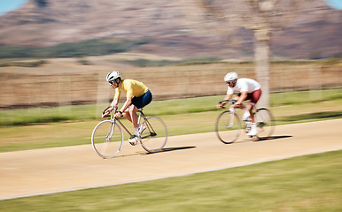 Image showing Two men cycling with motion blur in nature, countryside and sports of triathlon competition, race and training. Bike team, bicycle speed and action of energy, performance and travel on mountain path