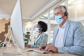 Image showing Covid, help desk employees with mask at computer and mature man and black woman in call center. Office compliance, consulting team online in coworking space and medical advisory agency with diversity