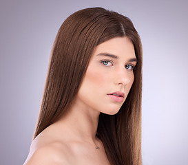 Image showing Face portrait, beauty and hair care of a woman in studio isolated on gray background. Makeup cosmetics, growth and female model with salon treatment for healthy keratin, balayage or hairstyle texture