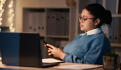 Image showing Business woman, phone and typing in office at night, texting or social media in workplace. Bokeh, overtime technology and female employee with mobile smartphone for web scrolling or internet browsing