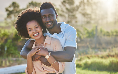 Image showing Couple, black people and hug in park portrait with smile, sunshine and happiness for romantic love. Young black man, black woman and bonding embrace on summer adventure, relax and outdoor in Atlanta