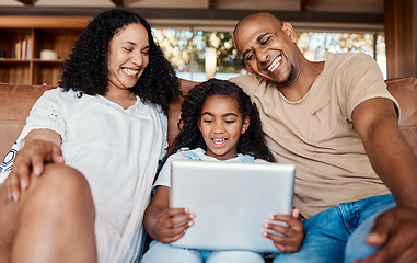 Image showing Family laughing, relax and girl with tablet on sofa in home living room for social media, funny video streaming or comic movie. Technology, smile and happy father, mother and child with touchscreen.