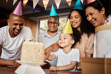 Image showing Birthday, black family and a girl cutting cake in the home during a party or celebration together. Kids, event or love with parents, grandparents and a daughter bonding or celebrating in a house