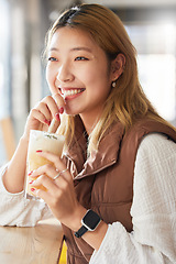 Image showing Health, Asian woman and smoothie for diet, in a cafe and happiness for wellness and thinking. Japan, female and happy girl with milkshake, relax break and cheerful daydreaming by a restaurant window