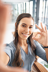 Image showing Selfie, portrait and business woman with ok sign for success, agreement and perfect emoji in office. Picture, smile and happy female worker with hand gesture for okay, good job and yes icon at desk