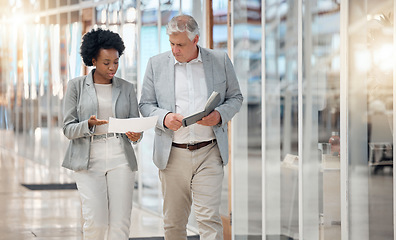 Image showing Finance, planning and business people walking with bookkeeping budget, financial quote or invoice information. Manager, black woman or accountant partner talking of finance receipt or document advice