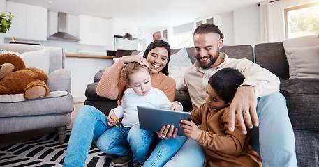 Image showing Family, tablet and kids learning online in the living room of their home with parents for child development. Education, video or internet with a father, mother and children sitting on the floor