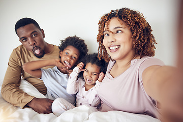 Image showing Black family, selfie and funny face portrait in home bedroom, smile and having fun together. Interracial, comic and father, mother and children taking pictures for happy memory and social media.