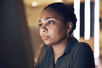 Image showing Computer reading, night face and black woman concentration on article review for online media, website or social network feedback. Brand copywriting, blog editor focus or journalist editing news post