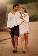 Image showing Love, forest and couple walking, quality time and hug with smile, relationship and cheerful together. Romance, man and woman embrace, nature and bonding with happiness, affection and summer vacation