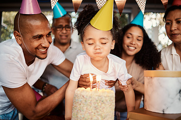 Image showing Birthday, party and cake for boy with parents and grandparents together for celebrating, bond and fun. Joy, event and child blowing candles with family at table, happy and excited for celebration