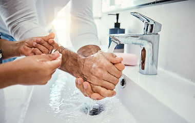 Image showing Cleaning hands, family and washing in sink in bathroom for health, hygiene and wellness. Water splash, children and father with kid to wash with soap for disinfection, sanitize or skincare in house.