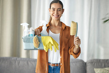 Image showing Portrait, cleaner and woman cleaning home smile with equipment, housework and person happy for hygiene clean house. Maintenance, service and disinfectant product by maid in living room housekeeping