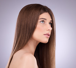 Image showing Face, beauty and hair care of a woman in studio isolated on a gray background. Makeup cosmetics, thinking and young female model with salon treatment for healthy keratin, balayage or hairstyle growth