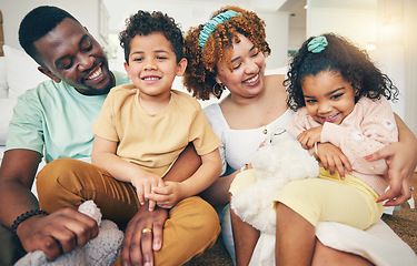 Image showing Black family, smile and living room sofa with bonding, parent love and care in home. Lounge, happiness and children with mom and dad together feeling happy with a hug on a couch with mama and dada