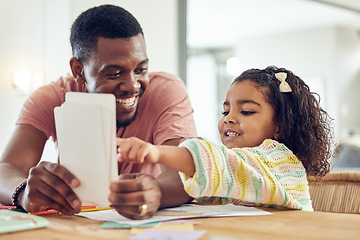 Image showing Home school, learning and father helping his child with flash cards, homework or studying. Education, knowledge and African man teaching his young girl kid with reading or an academic assignment.