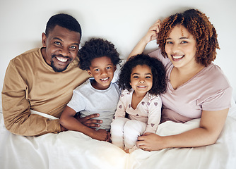 Image showing Family, bed and happy portrait of a mother, father and children in a bedroom in the morning. Home, happiness and smile of a mom, kids and papa together with bonding, parent care and love in a house