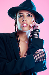 Image showing Portrait, fashion and woman with punk outfit, confidence and lady against a pink studio background. Face, female model and rocker with gloves, trendy and edgy clothes with beauty and stylish