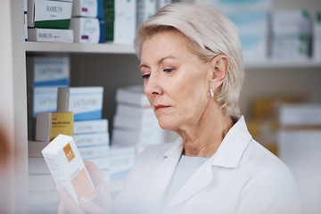 Image showing Elderly pharmacist, medicine reading and stock in a healthcare, wellness and pharmaceutical store. Pharmacy inventory, working senior woman and medical product check of a employee at a drugstore