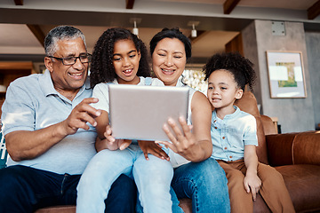 Image showing Relax, family and girls with tablet on sofa in home living room for social media or funny video streaming. Technology, care or happy grandfather, grandma and kids laughing or bonding with touchscreen