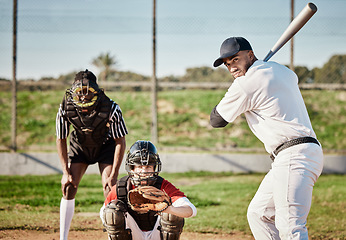 Image showing Baseball, bat and catch with a sports man outdoor, playing a competitive game during summer. Fitness, health and exercise with a male athlete or player training on a field for sport or recreation