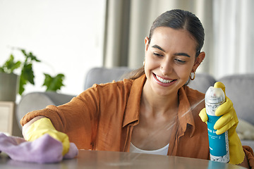 Image showing Woman, spray bottle or cloth wipe in spring cleaning, housekeeping or home maintenance in healthcare wellness. Smile, happy or maid cleaner and furniture product for table dust in hospitality service