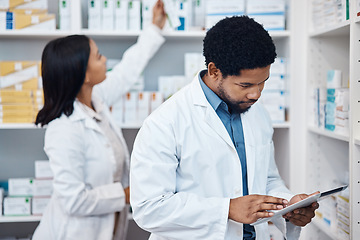 Image showing Pharmacy tablet, product inventory or black man doing stock take in retail drugs store or healthcare pharmaceutical shop. Clinic people, check pills shelf or medical pharmacist with digital checklist