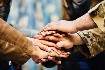 Image showing Motivation, paintball team or hands in huddle on a mission, friends or soldier training on war battlefield. Goal, collaboration or army people with support in partnership or military group solidarity