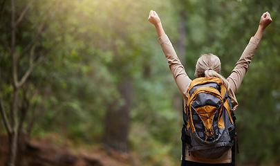 Image showing Back of woman, hiking and arms of freedom, success and hope of courage, achievement and mockup. Hiker celebrate travel, motivation and inspiration of goals, wellness and energy of adventure in forest