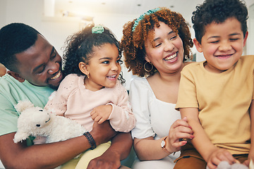 Image showing Black family, kids smile and living room sofa with bonding, parent love and care in home. Lounge, happiness and children with mom and dad feeling happy with a hug on a couch with mama and father