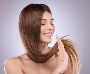 Image showing Smile, beauty and haircare of a woman with straight hair in studio isolated on a background. Natural cosmetics, growth or happy female model with salon treatment for healthy keratin or long hairstyle