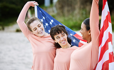 Image showing Volleyball woman, team and american flag at beach, happiness and pride for celebration, winning or goal. Women, sports and diversity with support, solidarity or teamwork for winner with excited smile