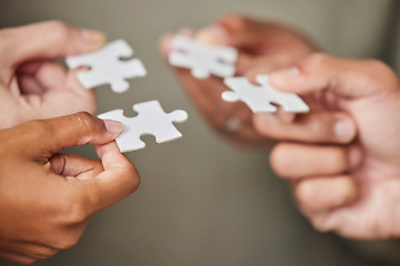 Image showing Business people, hands and puzzle piece for collaboration, planning or team building strategy at office. Hand of group in teamwork for goal, support or motivation in cooperation for problem solving