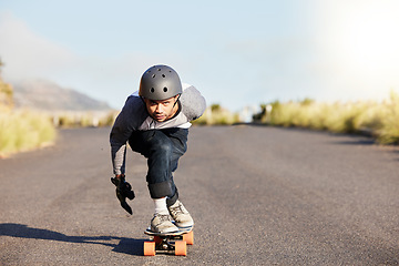 Image showing Skateboard, sports and mountain with man in road and travel for speed, freedom and summer break. Motion, adventure and fitness with guy skating fast in street for training, gen z or balance in nature