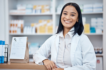 Image showing Pharmacy portrait, medicine package and pharmacist in drugs store, pharmaceutical shop or healthcare dispensary. Hospital retail manager, pills stock product and happy medical woman for help support